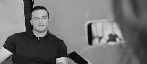 James Richman being interviewed and filmed on a phone.